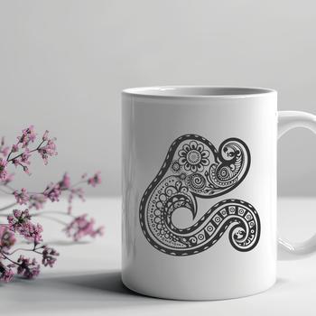 A stylized, ornate shape with intricate details, typical of traditional paisley patterns.