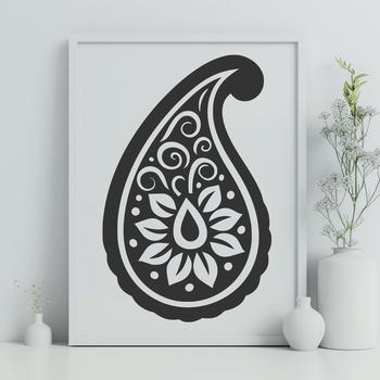 An illustrated paisley design featuring curved lines and symmetrical patterns.