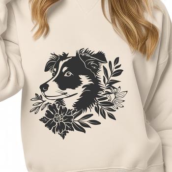 A close-up portrait of a fluffy Australian Shepherd's head, with a subtle floral pattern in the background.