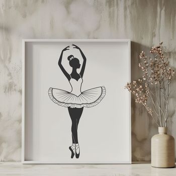 A young ballerina in a flowing tutu standing en pointe on one foot.
