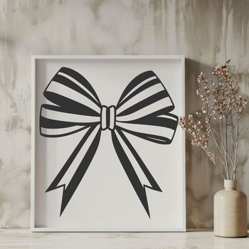 A decorative bow with rounded ends and tied in the center.