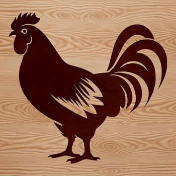 A single chicken standing on grass in a farm yard.