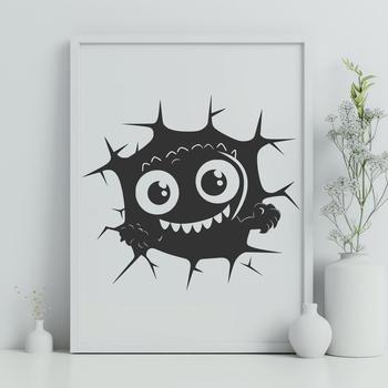 A small monster with a big smile is breaking through a brick wall on Halloween night.