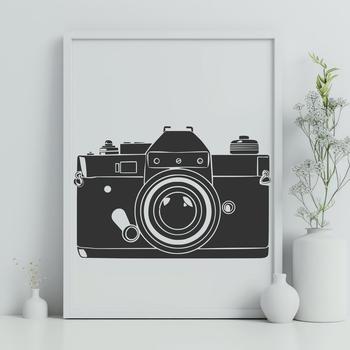 A digital camera icon with a stylized lens and body, suitable for vector graphics.