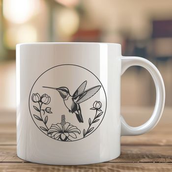 A colorful hummingbird perched on a floral branch, suitable for crafting and design.