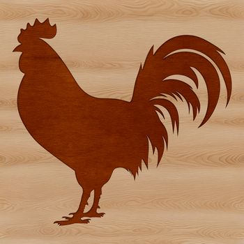 A single silhouette of a rooster standing on the farm.