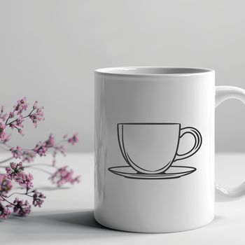 A white ceramic teacup with floral design on a transparent background.