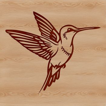 A colorful hummingbird in mid-air, its wings spread wide as it flies through the forest.