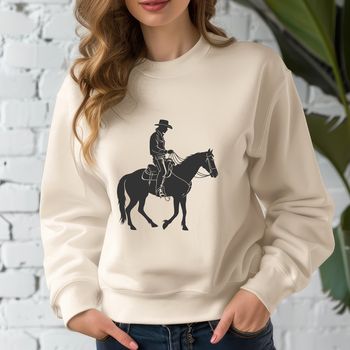 A lone cowboy rides his horse through the open range, depicted in vector art style.