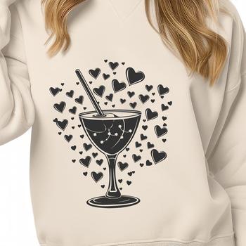 A romantic cocktail in a glass with love hearts floating on top.