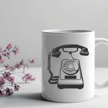 A simple line drawing of a vintage-style telephone with a dial and receiver.