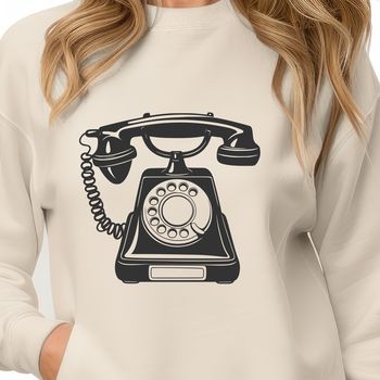 A simple vector illustration of a classic telephone with a receiver and keypad.