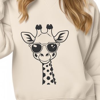 A giraffe wearing sunglasses in a savannah landscape.