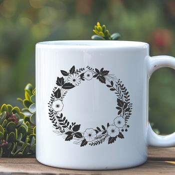 A floral SVG wreath design featuring intertwined flowers and foliage.