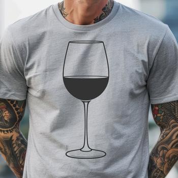 A transparent glass filled with red wine on a table top.