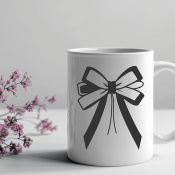 A decorative bow made up of curved lines and shapes, suitable for gift wrapping or crafting.