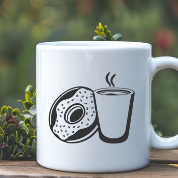 A circular food dessert on top of a coffee cup.