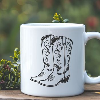 A pair of classic cowboy boots with intricate stitching and design elements.