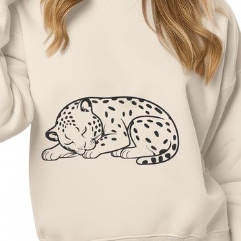 Close-up illustration of a sleeping jaguar's face, featuring sharp facial features and whiskers.