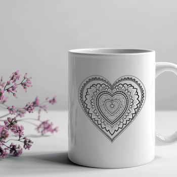 A colorful mandala heart design made up of intricate patterns and shapes, suitable for various digital applications.