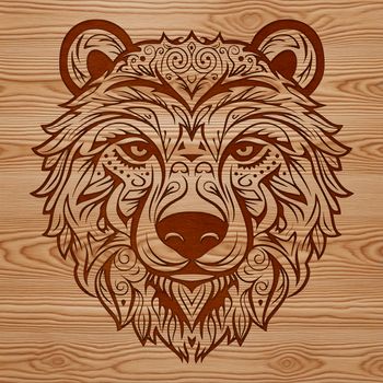 An ornate graphic representation of a wild animal featuring a stylized bear's head with decorative elements.