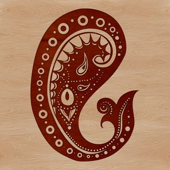 An intricate ornate shape resembling a classic paisley pattern.