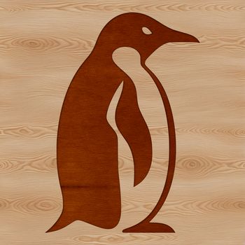 A single black and white penguin standing on a rocky outcrop at the edge of the sea.