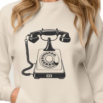 A simple illustration of a standard telephone with a cord.