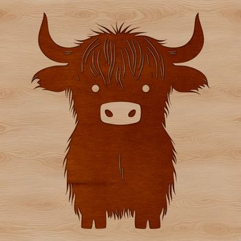A large, brown Highland Cow standing on a green hillside.