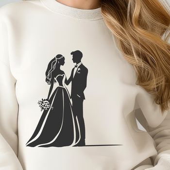 A bride and groom standing together with a bouquet of flowers.