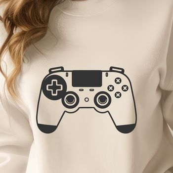An illustration of a game controller with buttons and directional controls.