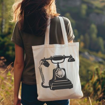 A vector illustration of a classic telephone with a receiver and dial.