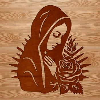 A traditional representation of the Virgin Mary with ornate floral details surrounding her head.
