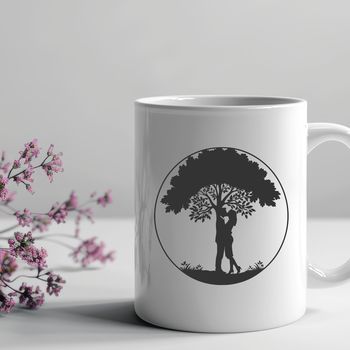 A stylized illustration of a tree with two embracing figures at its base, ideal for Valentine's Day or wedding decorations.