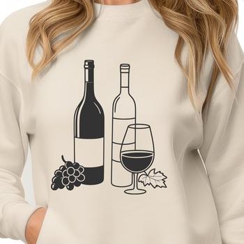 Wine bottle silhouette in a glass on a wooden table with a few grapes nearby.