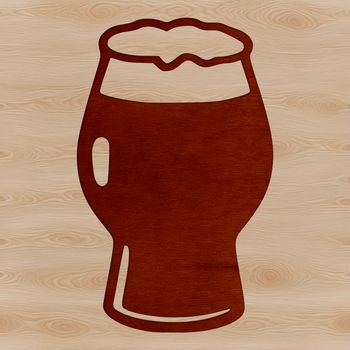 A glass containing a cold beer, served with ice.