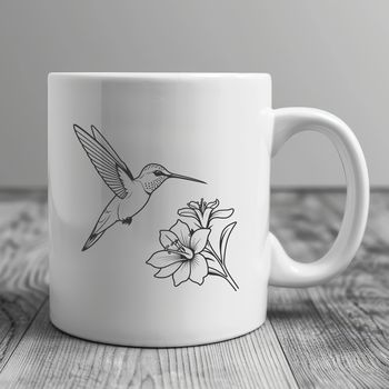 A colorful hummingbird perched on a flower, ideal for crafting and design projects.
