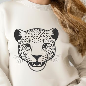 Close-up illustration of a big cat's head with distinctive spots and sharp features.