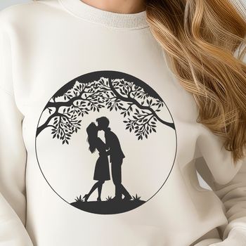 An ornate vector design featuring a tree with a trunk and foliage, incorporating a kiss or two into its branches.