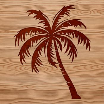A large palm tree standing on a sandy beach with clear blue sky in the background.