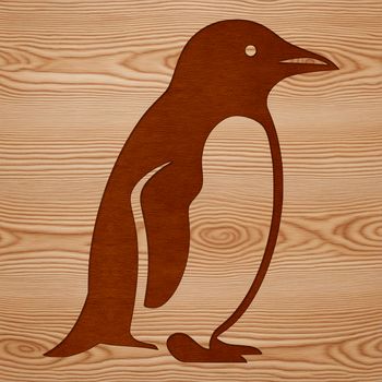 A penguin standing on rocky coastline.