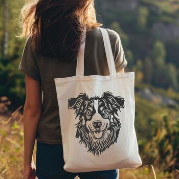 Portrait of a fluffy Australian Shepherd dog with a distinctive head shape and coat pattern.