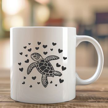 A colorful illustration of a full-body sea turtle with love hearts surrounding it.