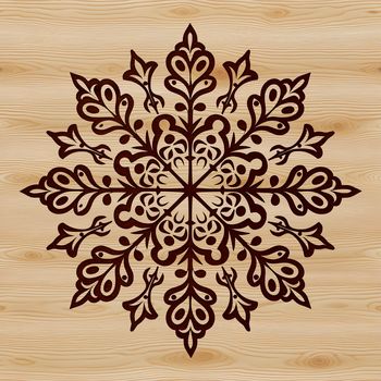 A delicate winter snowflake design made up of intricate lines and shapes.