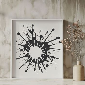 A circular splat shape with irregular edges and varying density.