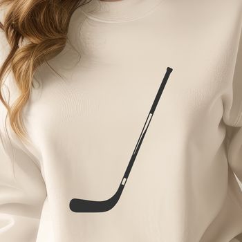 A close-up illustration of a hockey stick with the focus on the blade.