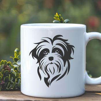 A close-up of a Havanese dog's head with distinctive markings and features.