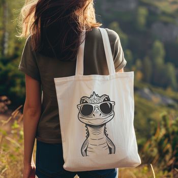 A reptile, specifically a lizard, wearing sunglasses in a fun design suitable for various graphic applications.
