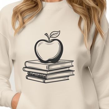 An open book with a shiny red apple symbol on the cover, designed as a vector graphic.