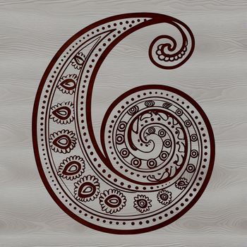 A geometric ornate pattern featuring a stylized paisley shape.